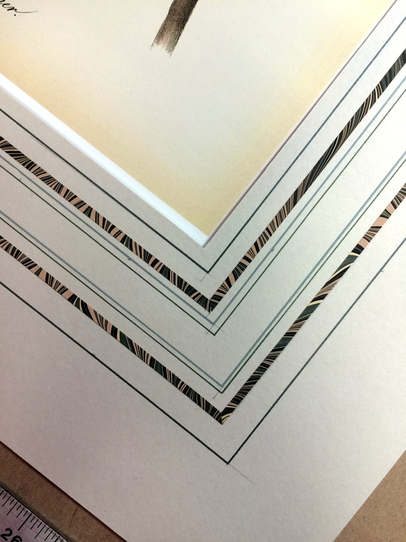 Close-up of a mitered frame corner with a white mat